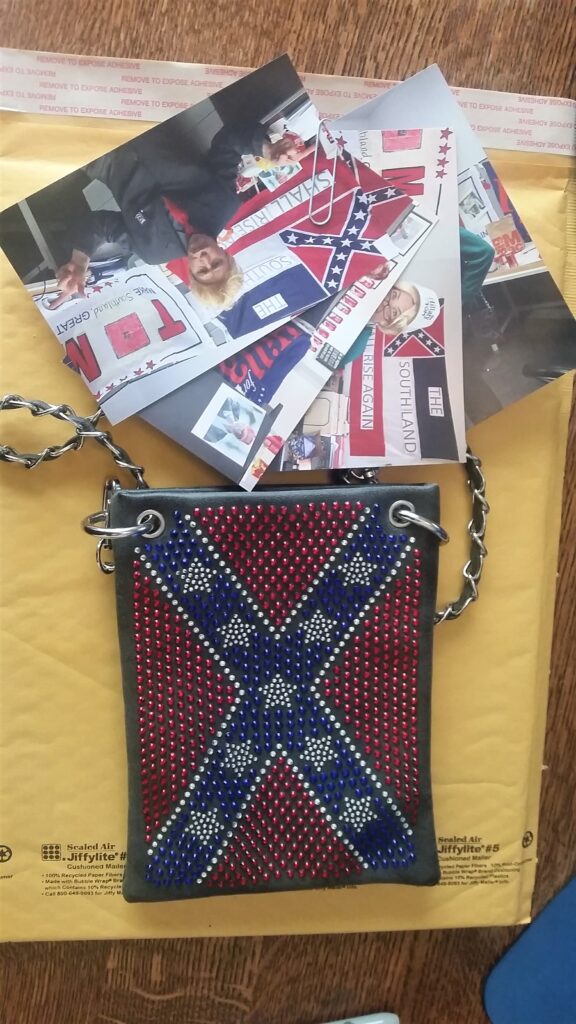 Confederate flag purse with photos inside the purse given to Tishay Wright by Kenneth and Anita Hayden as a Christmas gift at a company party.