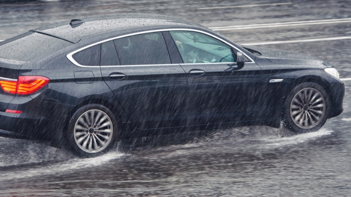 Car driving in heavy California rain